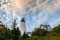 Dramatic Sky and Evergreens by Dice Head Light in Maine